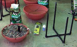 PVC pipe stands were made to hold the water lily pots level and at the correct depth.